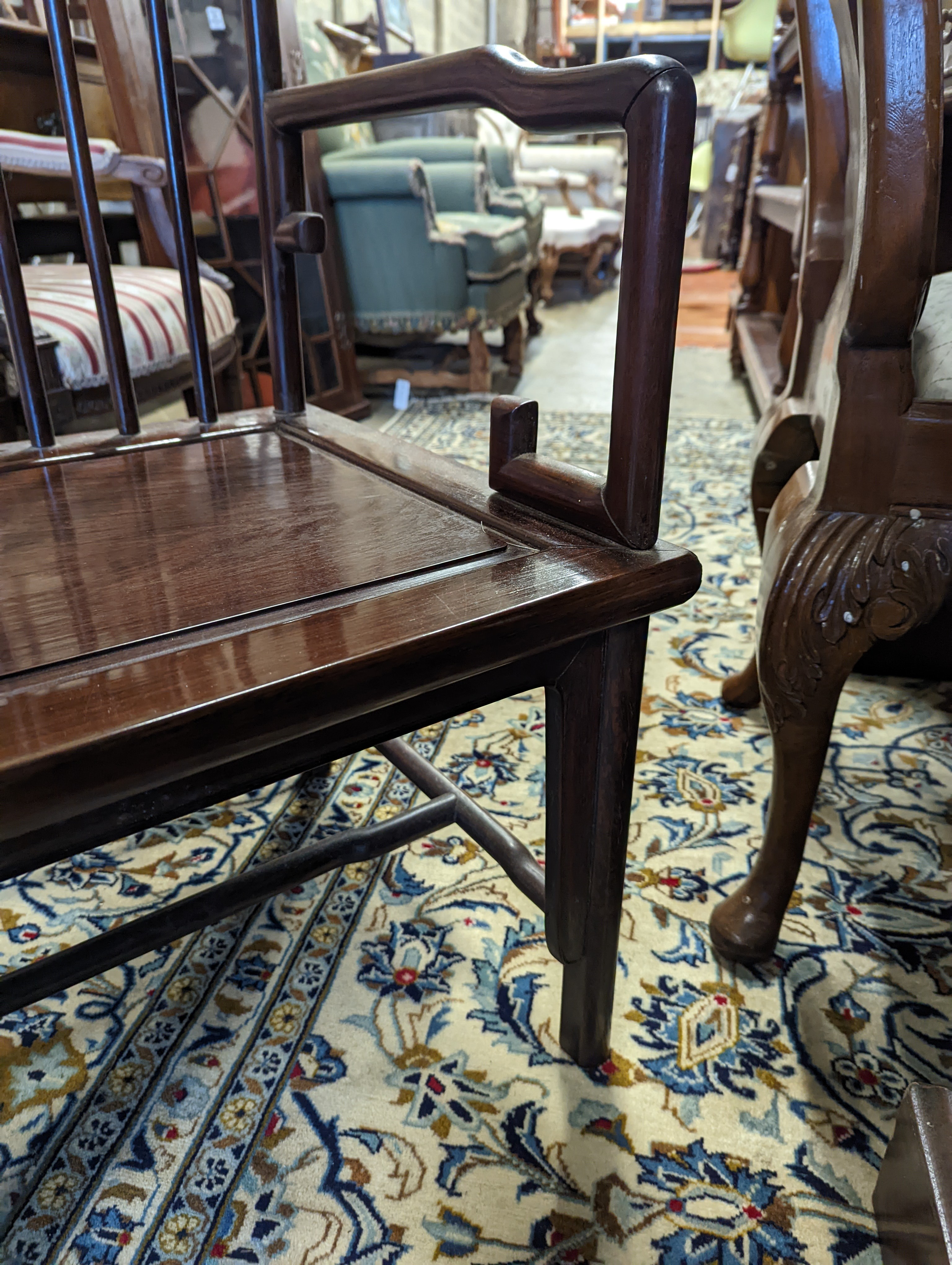 A pair of mid 20th century Chinese Hongmu elbow chairs with cushion seats, width 58cm, depth 49cm, height 92cm